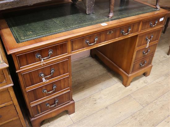 A modern yew wood pedestal desk, W.137cm H.76cm D.68cm